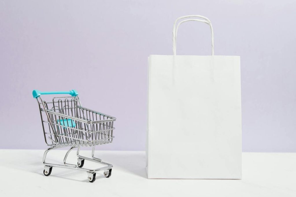 shopping cart next to a shopping bag